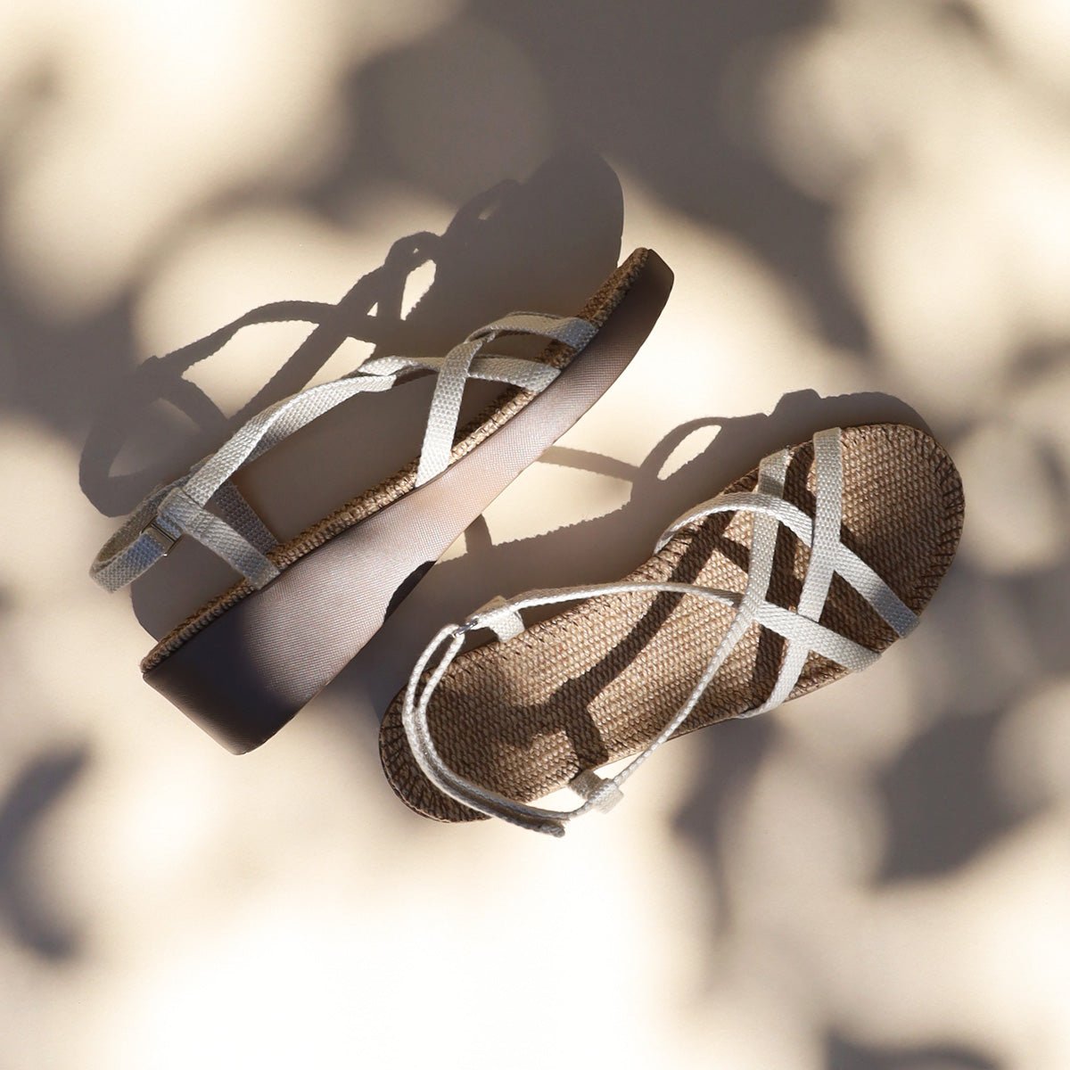 
                  
                    Pair of Shangies Women#3 wedge sandals in Jazzy Cloud in dappled sunlight
                  
                