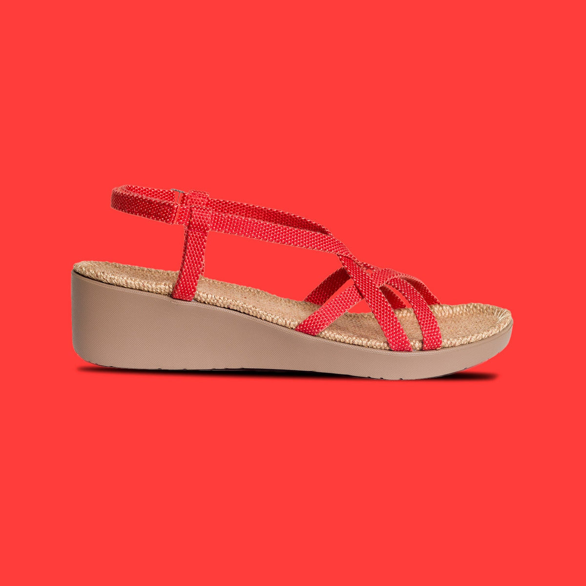 
                  
                    Side view of a Shangies Women#3 wedge sandal in Sassy Salsa against a red background
                  
                